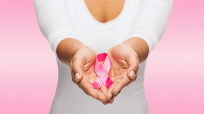 hands holding pink breast cancer awareness ribbon